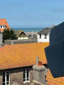 a view of roofs of buildings with houses at Les 4 saisons in Le Touquet-Paris-Plage