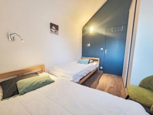 a room with two beds in a room at Apartment Les Alizés-1 by Interhome in Carnac-Plage