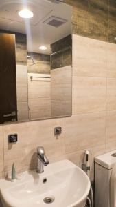 a bathroom with a sink and a toilet and a mirror at STAR AL SALAM St in Salalah