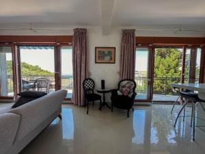 a living room with a couch and a table at Olive Residence Rezevici in Budva