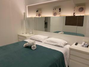 Letto o letti in una camera di Morada Supreme Itaim Bibi - Flat Duplo