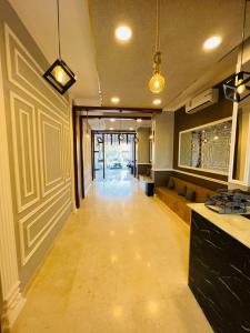 a room with a hallway with a long floor at STAR AL SALAM St in Salalah