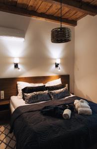 a bedroom with a large bed in a room at Zafír Vendégház in Sitke