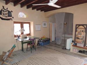 a living room with a ceiling fan and a table at Ohana retreat guest house in Tunis +8 photos