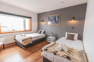 Voodi või voodid majutusasutuse Pristine Patagonia Hotel toas