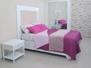 Ένα ή περισσότερα κρεβάτια σε δωμάτιο στο Apartahotel-E vista catalina