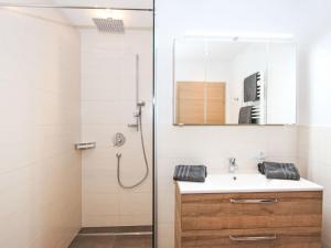 A bathroom at Apartment Dengg by Interhome
