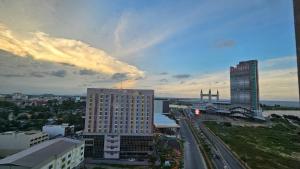a view of a city with tall buildings and roads at Siti Seaview Homestay, Pangsapuri Ladang Tanjung, Kuala Terengganu in Kuala Terengganu