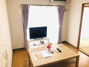 Televiisor ja/või meelelahutuskeskus majutusasutuses 桜並木と航空公園の近くにある閑静なお部屋 最大5名 t10