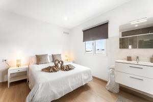 Ένα ή περισσότερα κρεβάτια σε δωμάτιο στο Villa Rayco +18 φωτογραφίες