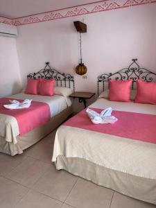 Postel nebo postele na pokoji v ubytování Hotel Zaci