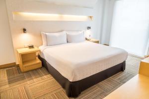 Un ou plusieurs lits dans un hébergement de l'établissement Sonesta Hotel Bogotá