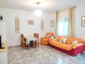 a living room with a couch and a table at Casa Rural La Bonica in Molinicos