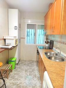 a kitchen with a sink and a counter top at Casa Rural La Bonica in Molinicos