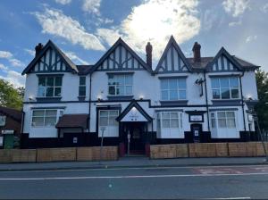a black and white building on the side of a street at The Prince Alfred Rooms in Liverpool