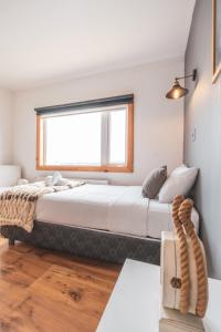 Voodi või voodid majutusasutuse Pristine Patagonia Hotel toas