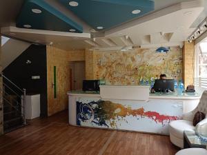 a room with a counter in a room with at Joy Lux Stay in Bengaluru