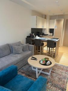 a living room with a couch and a table at Zepterme lux in Vrnjačka Banja