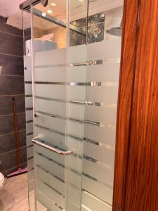 a shower with glass doors in a bathroom at Luxury apartment b3 Mdinaty in Madinaty +34 photos