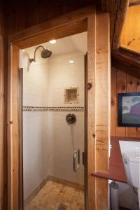 a shower with a glass door in a bathroom at The Spirit Horse Farm, Kent Connecticut in Kent