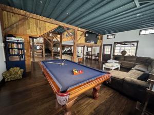 a living room with a pool table in it at The Spirit Horse Farm, Kent Connecticut in Kent
