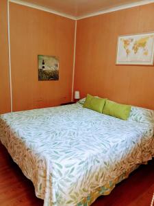 Postel nebo postele na pokoji v ubytování Residencial HITAPUHAN