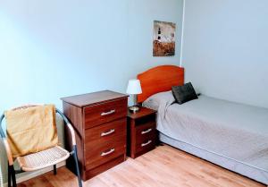 Postel nebo postele na pokoji v ubytování Residencial HITAPUHAN