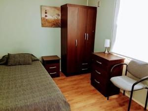 Postel nebo postele na pokoji v ubytování Residencial HITAPUHAN