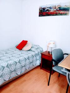 Postel nebo postele na pokoji v ubytování Residencial HITAPUHAN