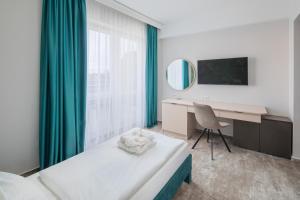 Postel nebo postele na pokoji v ubytování Hotel Atlantis Wellness & Conference