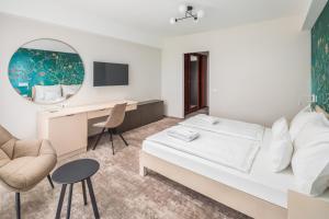 Postel nebo postele na pokoji v ubytování Hotel Atlantis Wellness & Conference