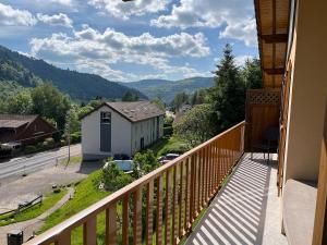 a balcony with a view of the mountains at Gîte La Bresse 7 personnes in La Bresse