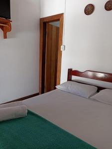 Postel nebo postele na pokoji v ubytování Pousada Portal da Mucugê