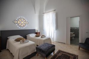 A bed or beds in a room at B&B Don Alessandro Még 37 kép