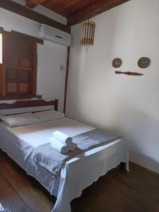 Postel nebo postele na pokoji v ubytování Pousada Portal da Mucugê
