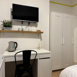TV a/nebo společenská místnost v ubytování Frankfield Terrace accommodation + 12 fotografií