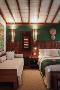 Postel nebo postele na pokoji v ubytování Vila Selvagem Hotel Contemporaneo + 37 fotografií