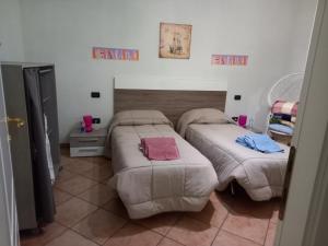 Postel nebo postele na pokoji v ubytování 4 giugno Ferrara