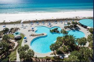 an aerial view of a resort swimming pool and the beach at Edgewater Golf Villa 1210 in Panama City Beach