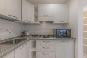 Kuchyň nebo kuchyňský kout v ubytování BRAND APARTMENT Vivi il Centro di Portofino