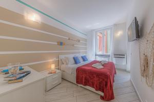 Postel nebo postele na pokoji v ubytování BRAND APARTMENT Vivi il Centro di Portofino