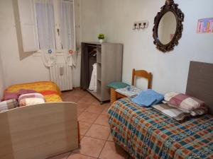 Postel nebo postele na pokoji v ubytování 4 giugno Ferrara