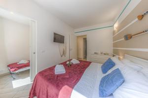 Postel nebo postele na pokoji v ubytování BRAND APARTMENT Vivi il Centro di Portofino