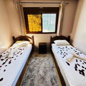 Postel nebo postele na pokoji v ubytování Hotel nabil
