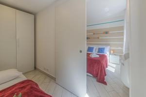 Postel nebo postele na pokoji v ubytování BRAND APARTMENT Vivi il Centro di Portofino