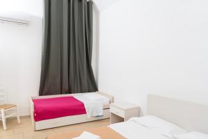 Postel nebo postele na pokoji v ubytování Casa BARRA by Tizzano House + 29 fotografií