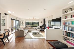 a living room with a couch and a table at Chez Pablo Barcelona in Cabrils