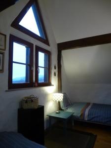 Postel nebo postele na pokoji v ubytování La Pomme de Pin