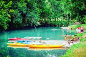 a group of kayaks and tables on a lake at Waterfront Prairie Flower Treehouse in Seguin +3 photos