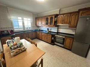 A kitchen or kitchenette at Apartamento Xoel
